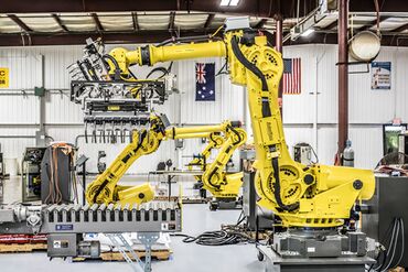 Material Handling Robot Versus Manual Labor and Associated Costs